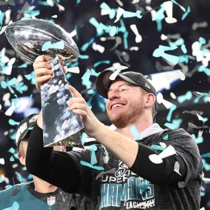 Carson lifting Super Bowl trophy